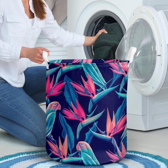 Tropical Flowers, Plants And Leaves Stand Out Against The Green Background Laundry Basket